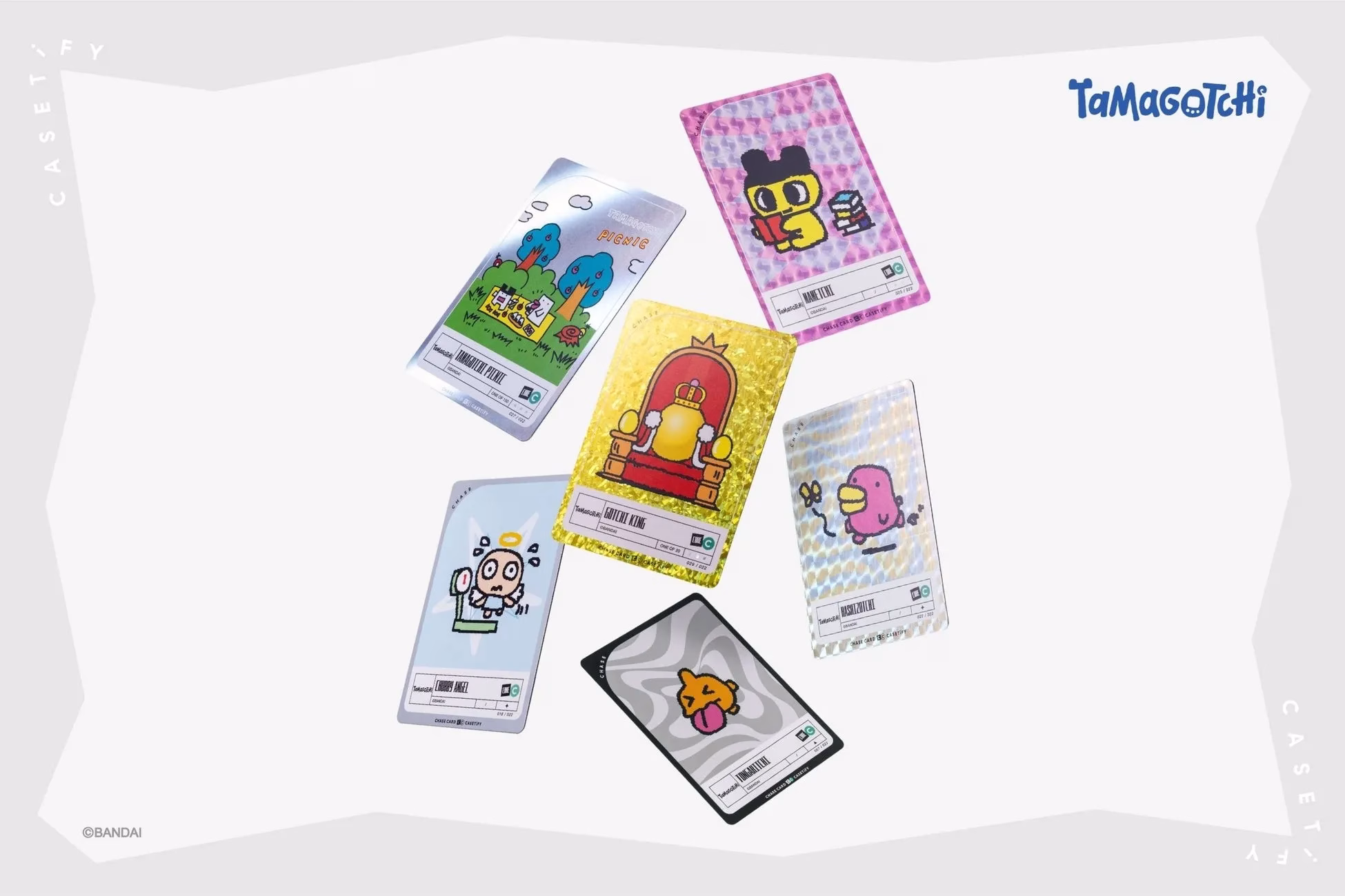Tamagotchiのカードが複数枚写っている写真。カードには様々なキャラクターが描かれており、背景は白。